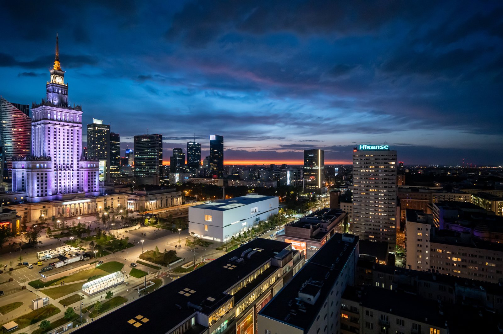 The Palace of Culture at night, with the white Museum of Modern Art building at its foot, August 2025.
